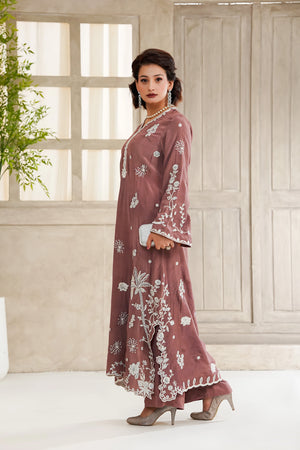 Girl wearing pastel kaftan dress for girls Pakistan by buraqstore