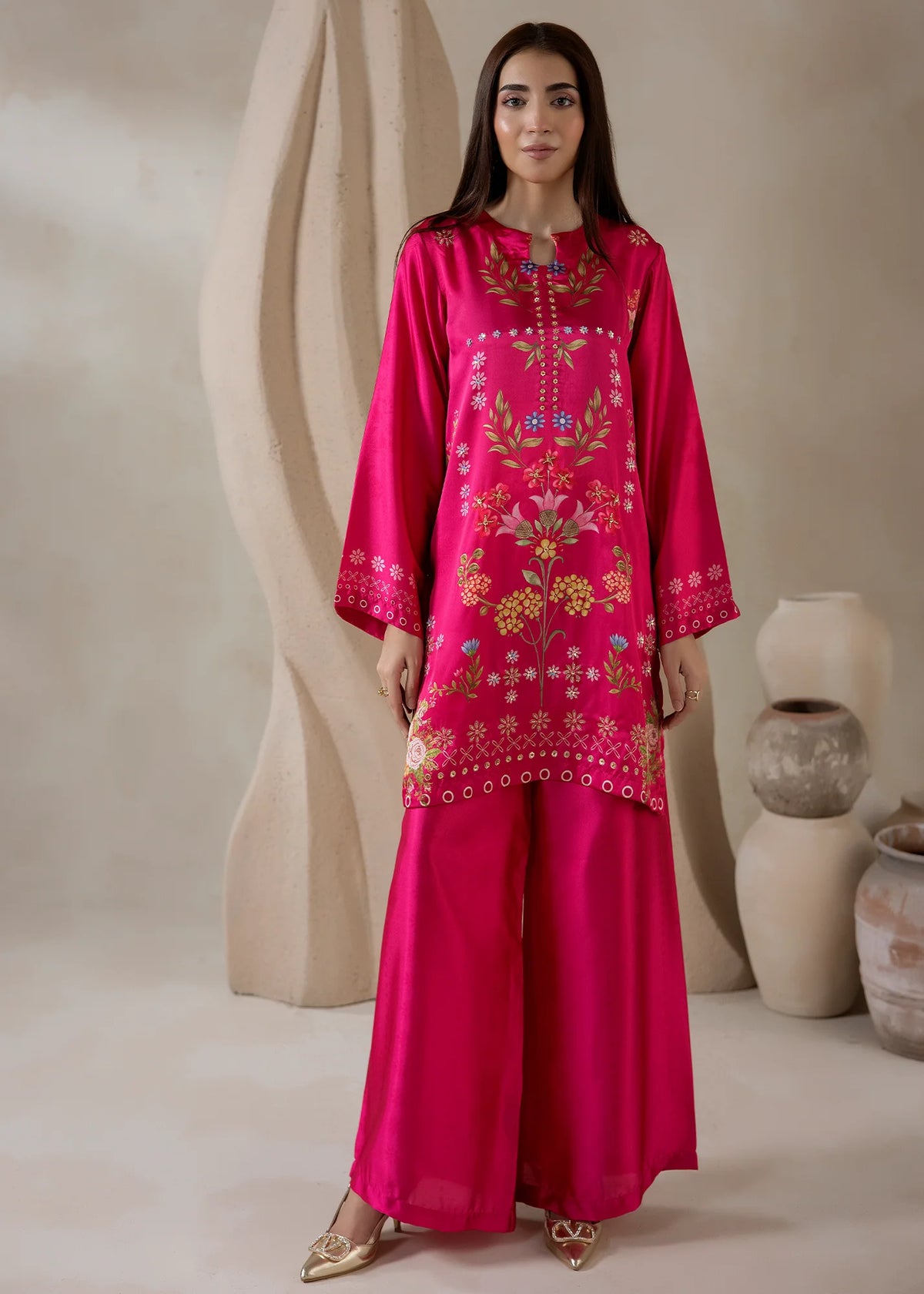 Model wearing silk coord set for women in pink, a printed charmeuse silk top and bottom, front view from Buraqstore