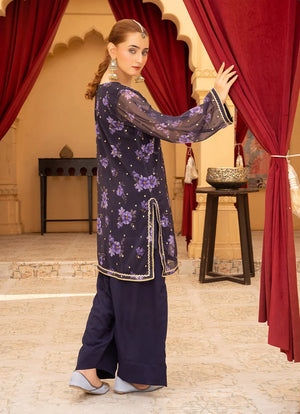 Women wearing purple colour dress, close-up of the gotta patti and tassel embellishments on the silk shirt, Buraqstore