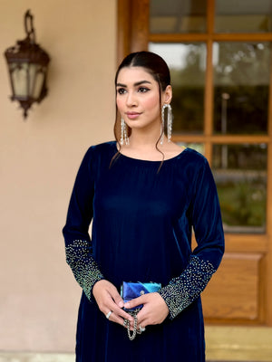 woman posing in royal blue dress by Buraqstore luxury formal wear