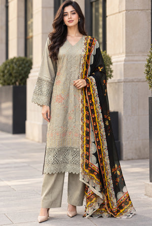 Model wearing sage green karandi suit, original karandi suit price in Pakistan for this unstitched 3PC, front view from Buraqstore