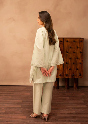 Women wearing green dress design, close-up of the embroidery on the lawn shirt, Buraqstore