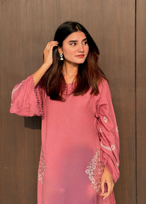 Model wearing tea pink color dress, side view showing the fit of the embroidered dhanak 2PC, Buraqstore