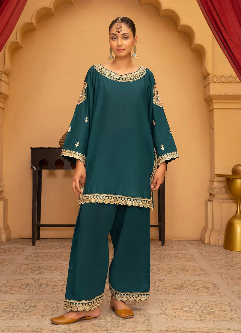 Model wearing teal blue color dress, embroidered bana dora fabric shirt and bottom, front view from Buraqstore