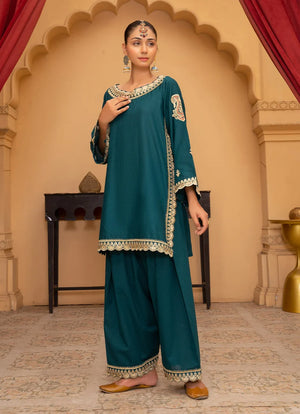 Women wearing teal blue color dress, close-up of the embroidery on the bana dora fabric, Buraqstore