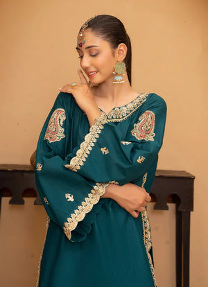 Model wearing teal blue color dress as an elegant outfit, shop the embroidered bana dora 2-piece set at Buraqstore