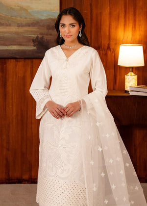 Model wearing white dress design, side view showing the fit of the lawn shirt and trouser, Buraqstore