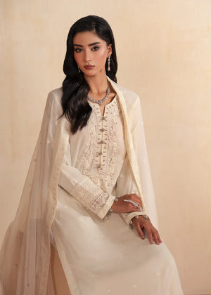 Woman wearing white dress design, close-up of the embroidery and embellishment on the chiffon shirt, Buraqstore