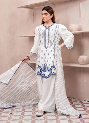 Model wearing white dress designs pakistani, side view showing the fall of the raw silk 3-piece set, Buraqstore
