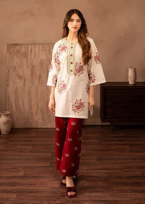 Model wearing red dress design finished in white, embroidered lawn 2PC set, front view from Buraqstore