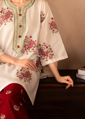 Model wearing red dress design as a festive outfit, shop embroidered lawn 2PC at Buraqstore