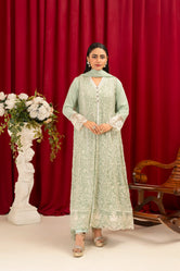 A woman wearing Buraq Store embroidery sale online Pakistan mint green chiffon pret set