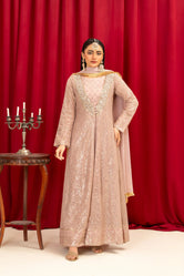 A woman wearing Buraq Store embroidery dresses in Pakistan lilac chiffon pret with fine embroidery