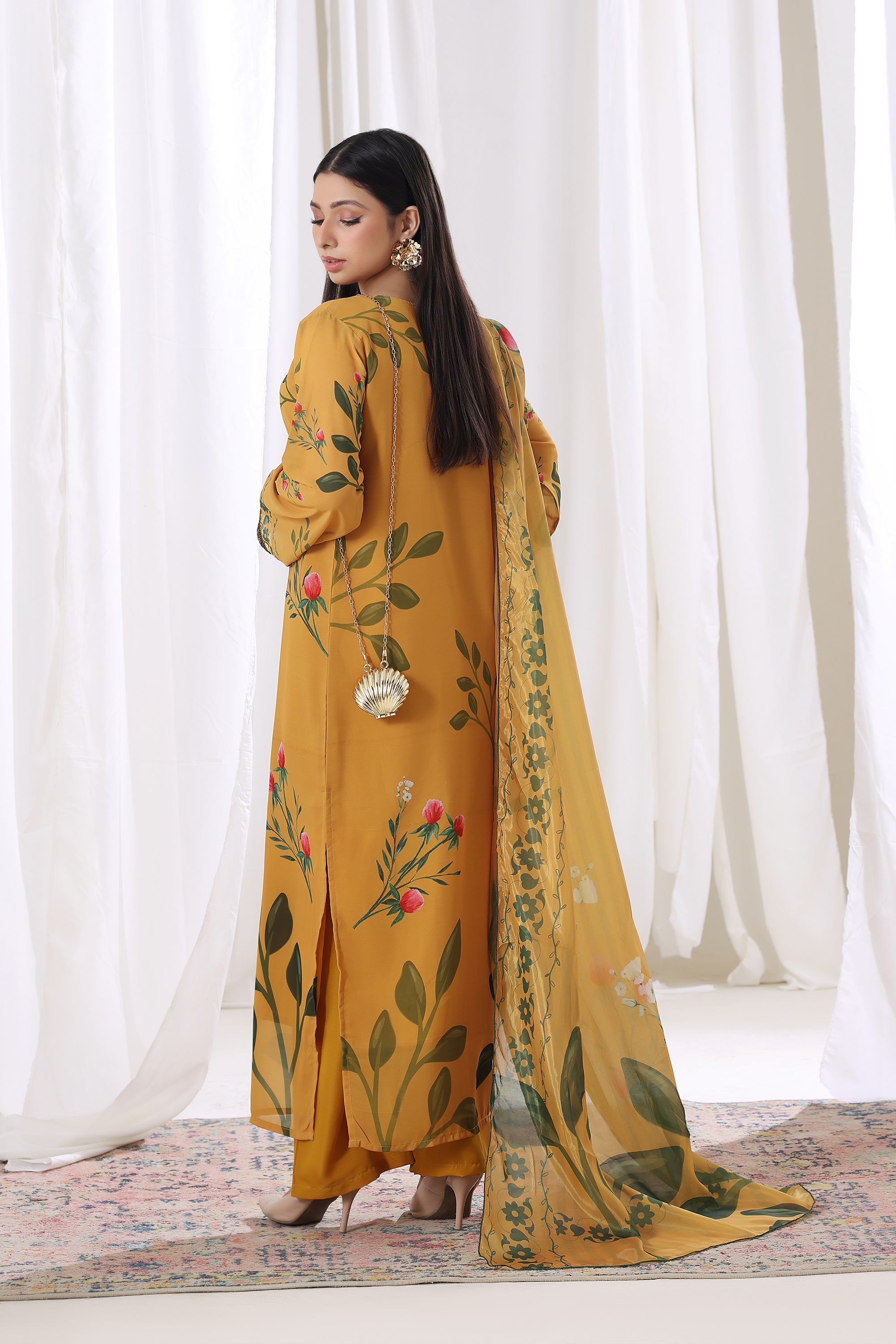 Female model wearing Golden Marigold chiffon pret Buraqstore, perfect party wear for ladies