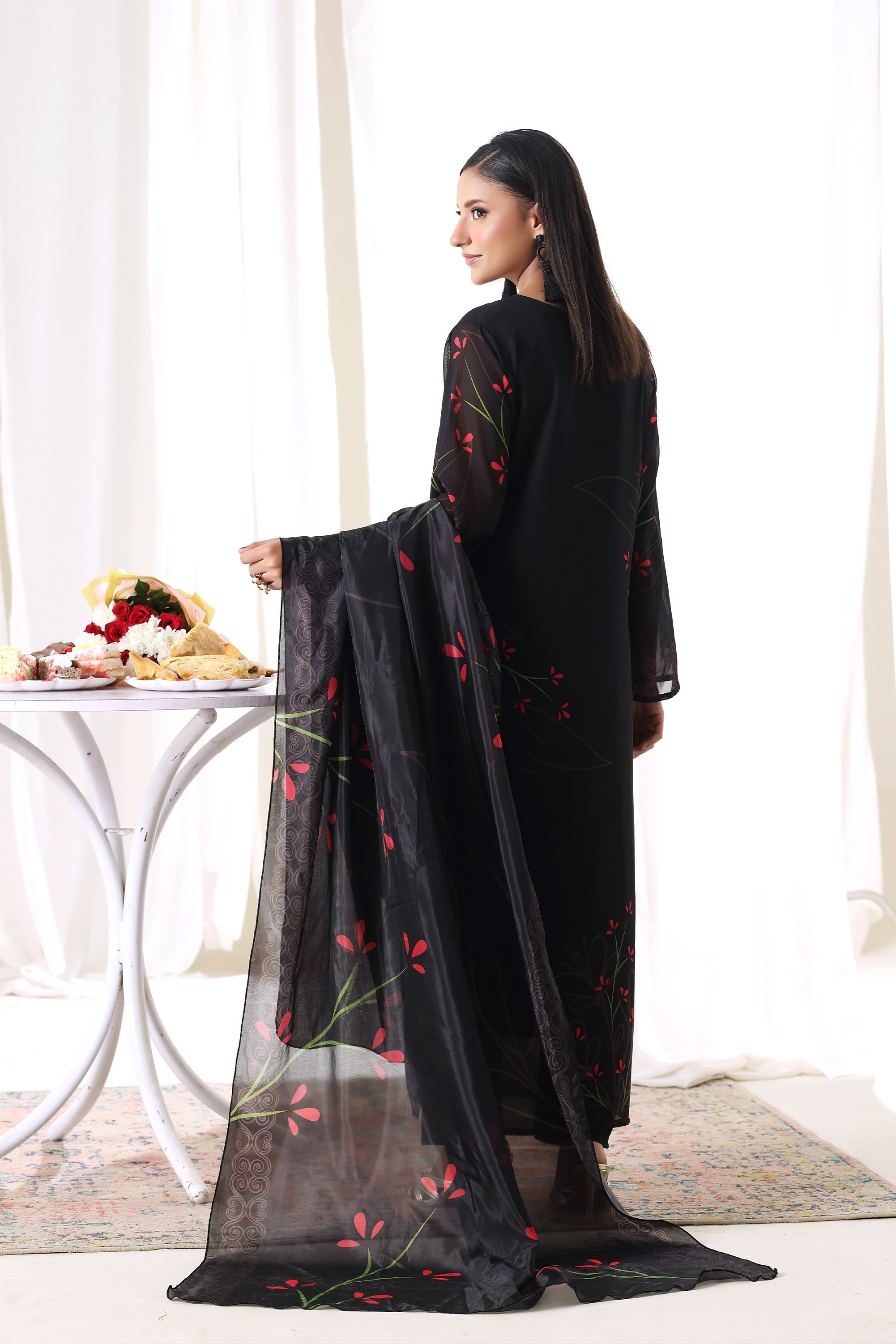 Female model in Midnight Flora chiffon pret from Buraqstore, perfect party dress