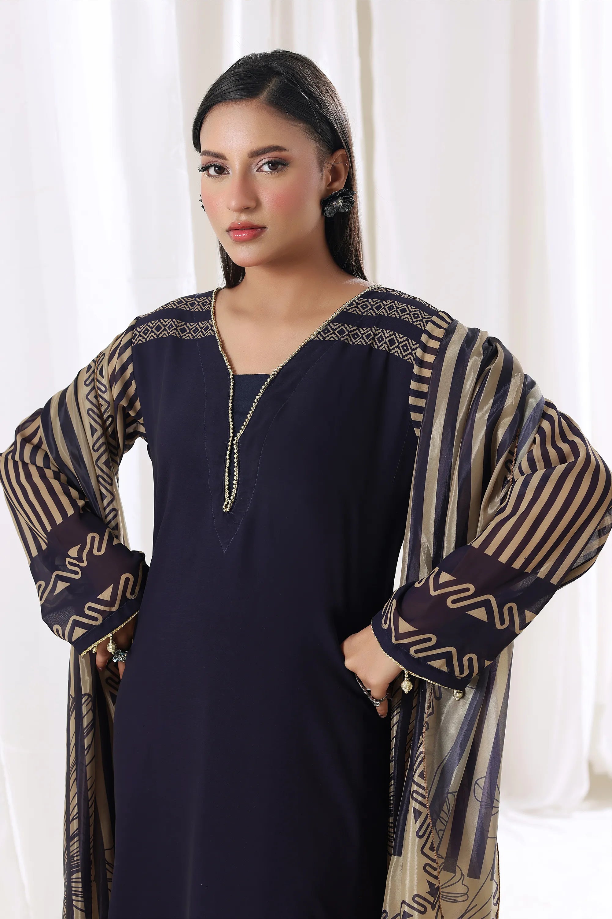 Young woman showcasing Azure Stripe chiffon pret dress from Buraqstore, perfect for parties in Pakistan