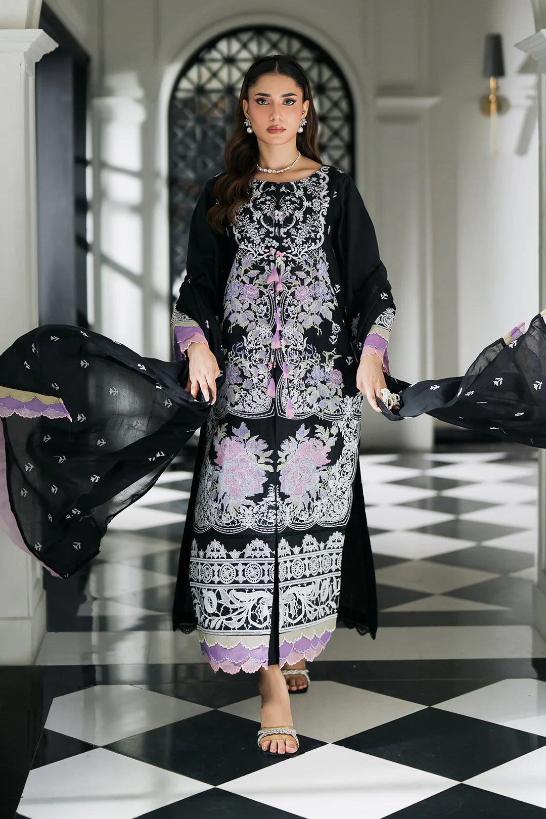 Woman posing in a black embroidered lawn 3 piece suit from Sidra Fahad official, featured at Buraq Store