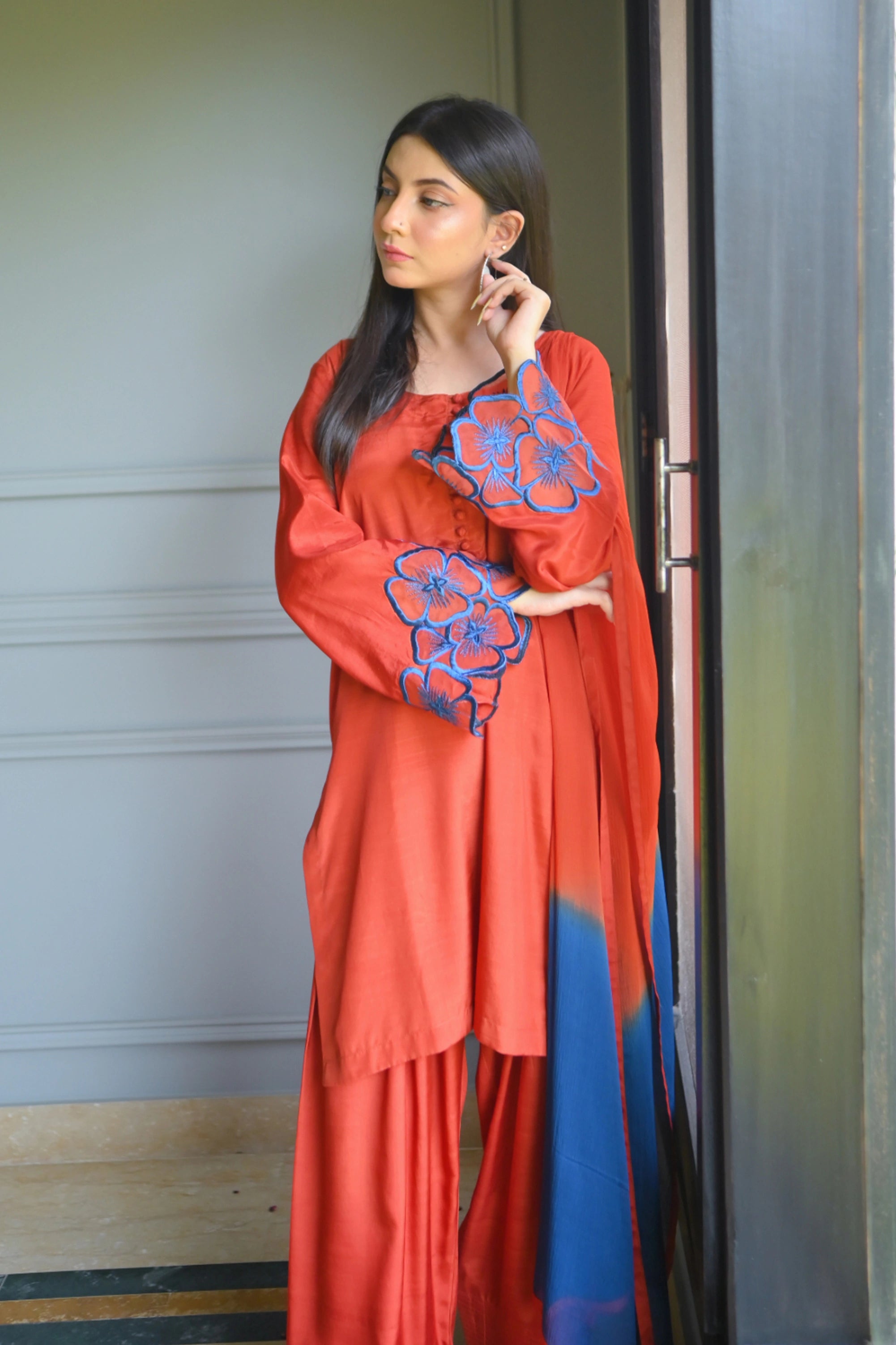 Girl wearing festive orange mehndi dress pakistani by buraqstore