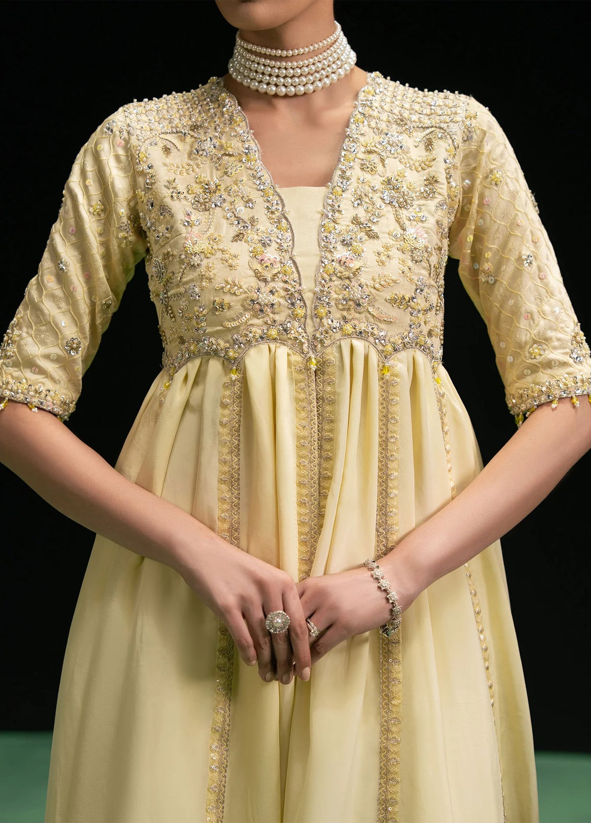 Woman posing in a stylish butter yellow Maelys 3 piece outfit from the Dastoor collection, featured at Buraq Store