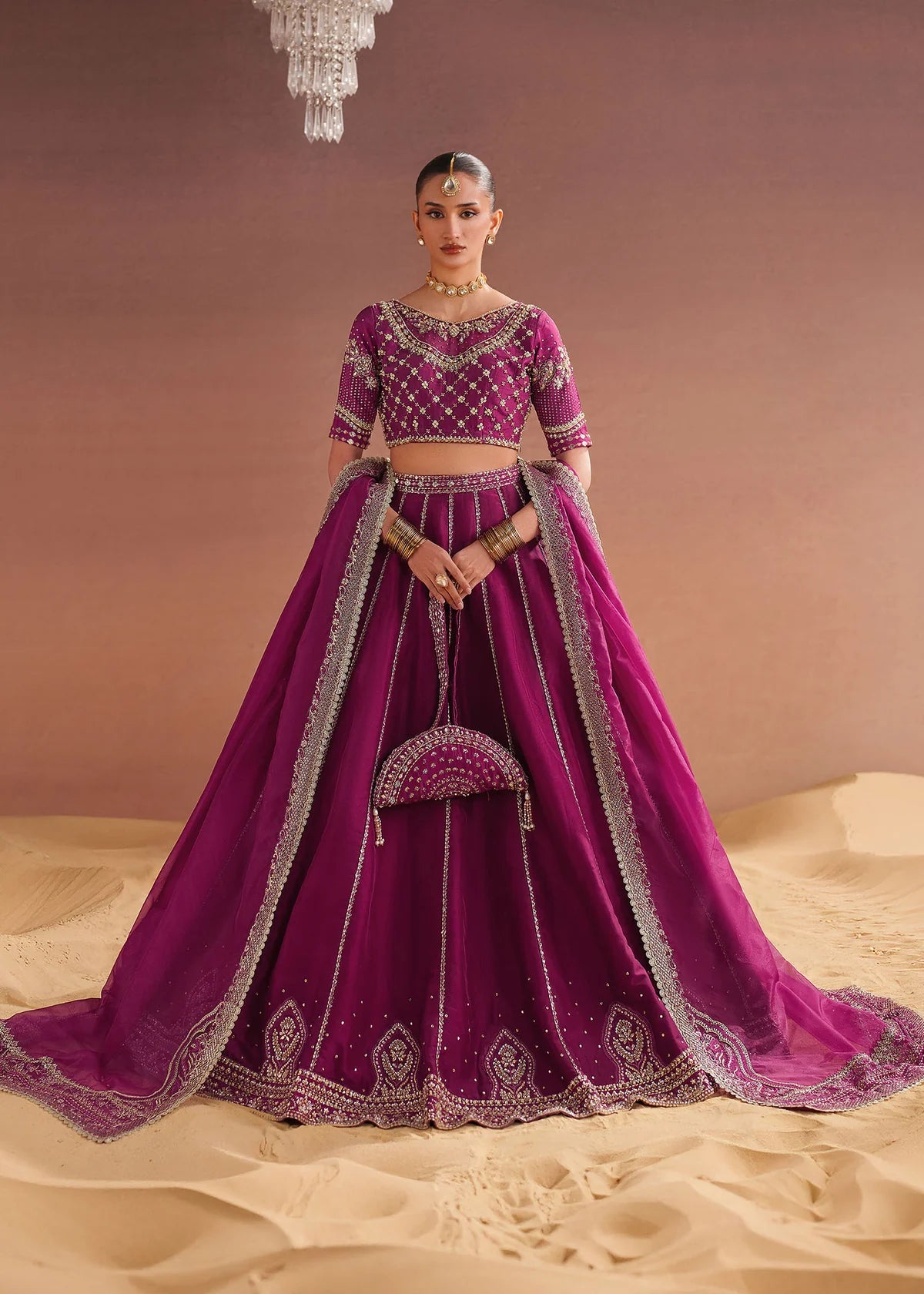 Model showcasing purple lehenga design in tissue silk by Buraqstore