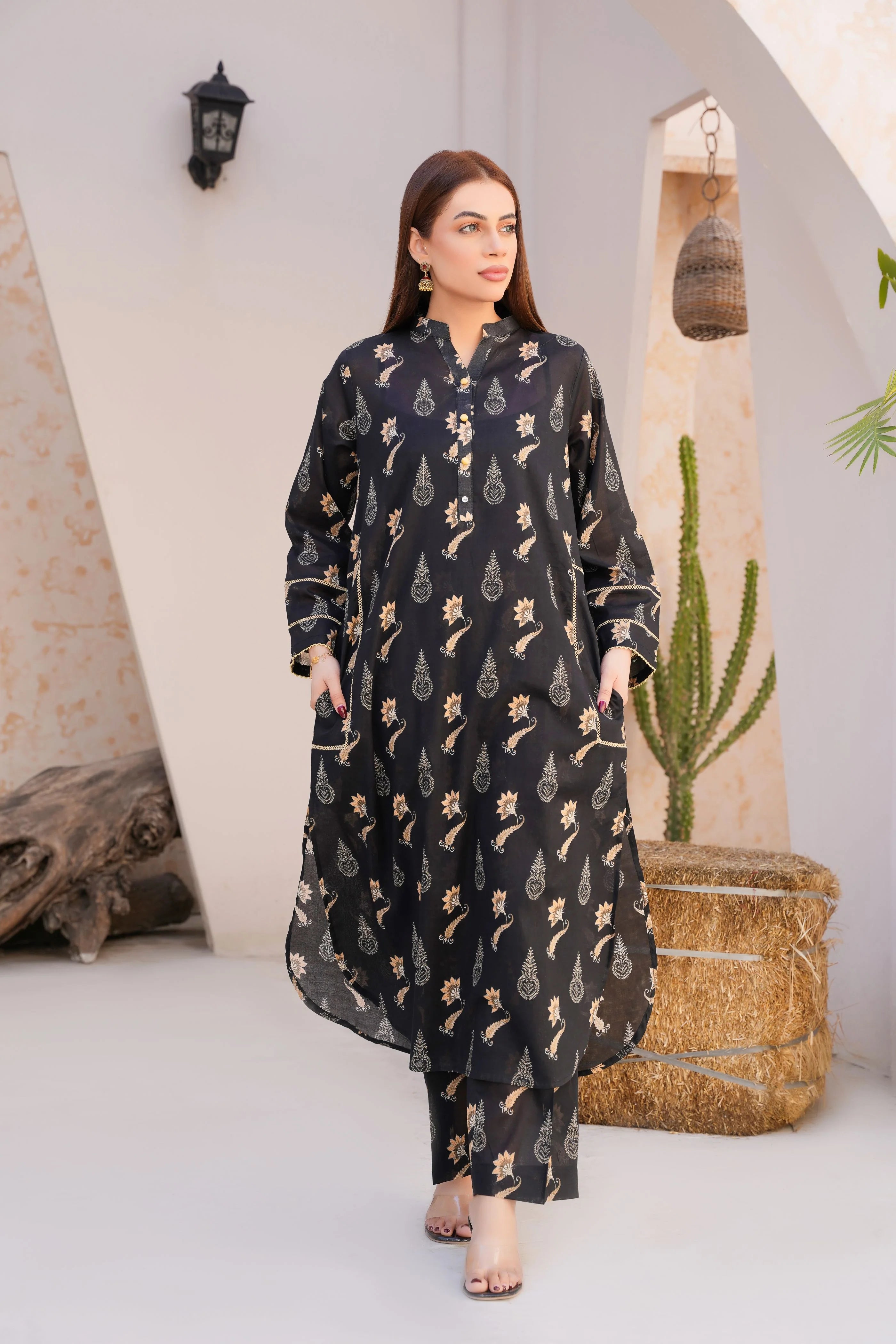 model wearing Buraqstore Elegant Floral Lawn Pret with black dresses look and printed details