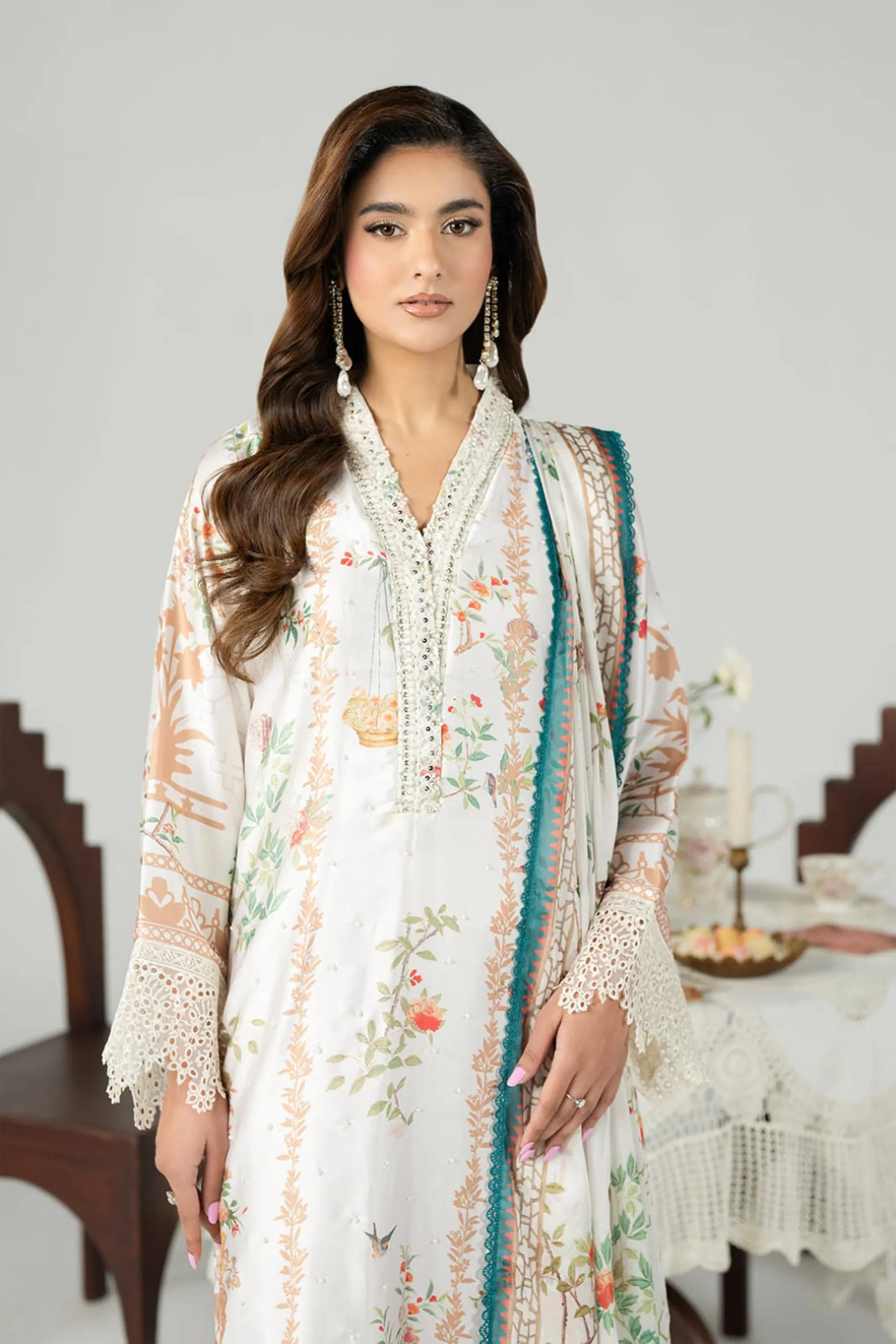 woman posing in white dress pakistani floral outfit buraqstore