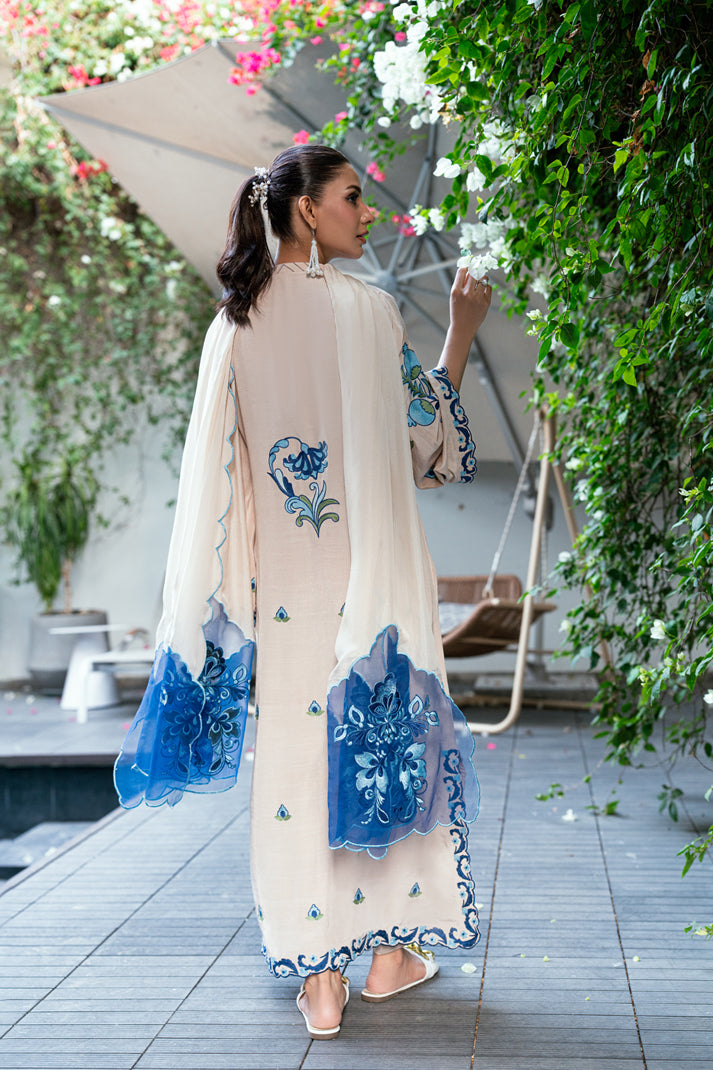 woman posing in white dress pakistani eid outfit buraqstore