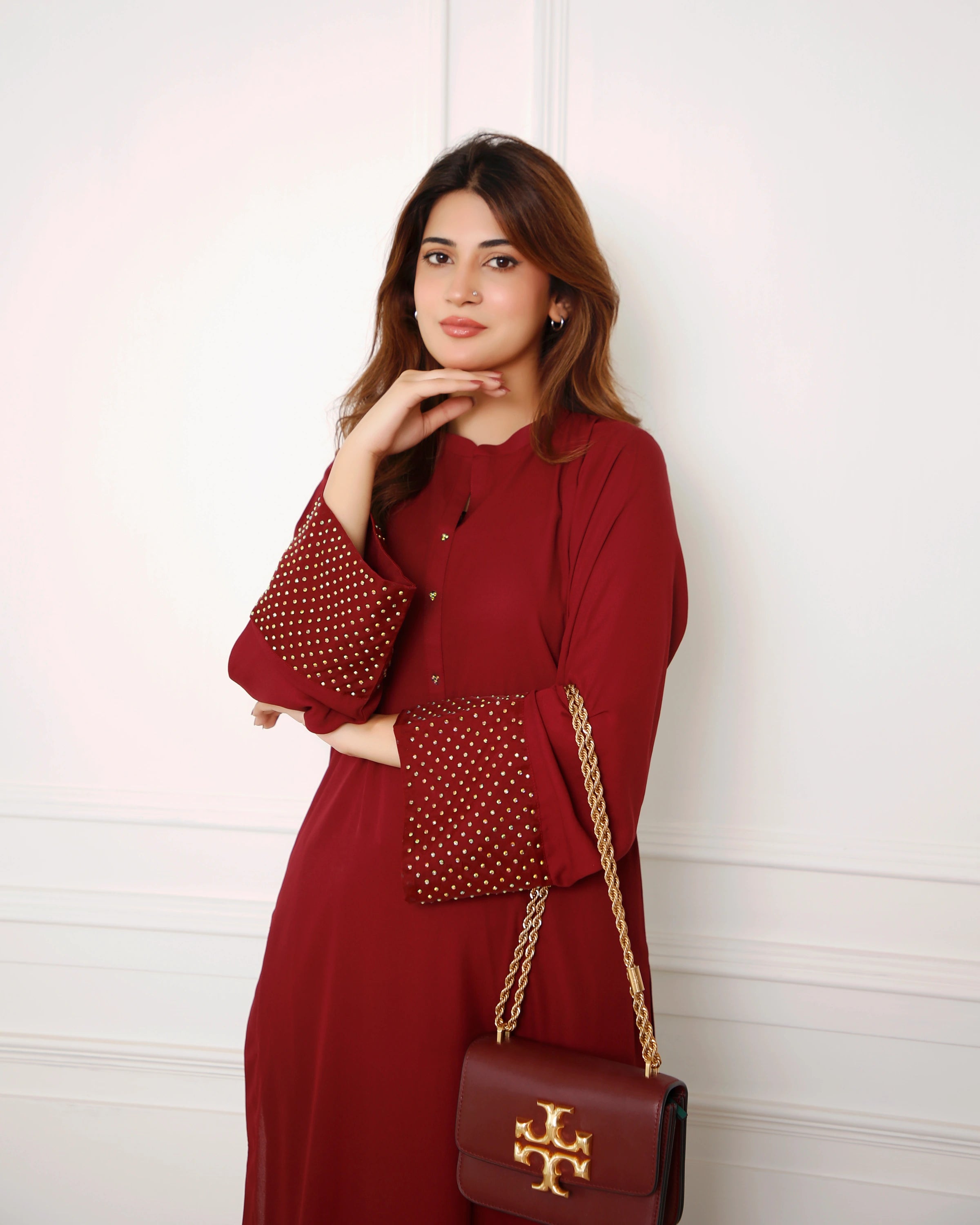 Buraqstore young girl posing in breezy red colour dress lawn 2pc with relaxed casual styling