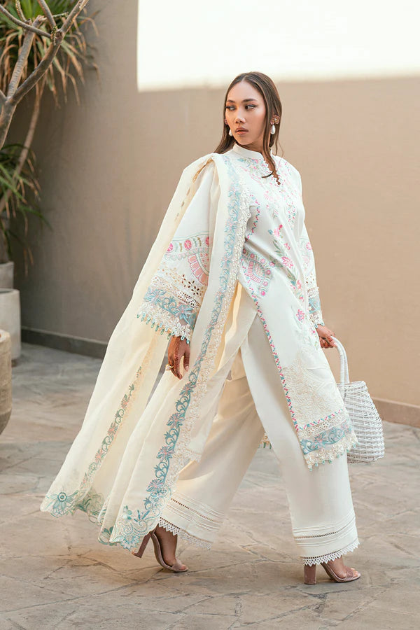 model dressed in white salwar kameez embroidered outfit buraqstore