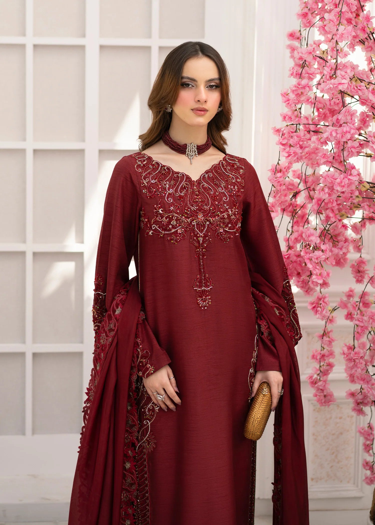 Girl wearing elegant maroon silk suit design by buraqstore Pakistan