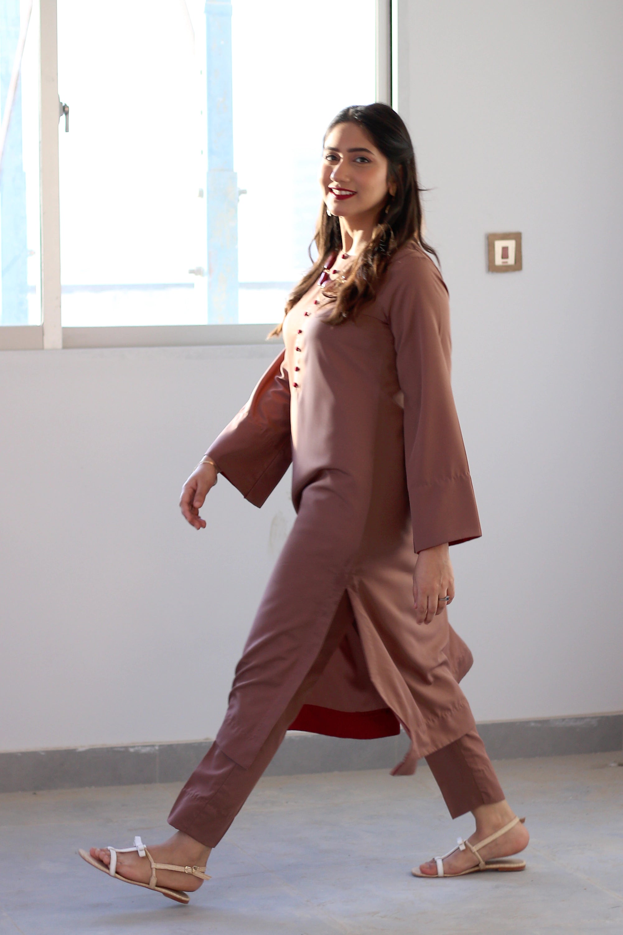 Girl wearing stylish georgette dress by Buraqstore with soft styling