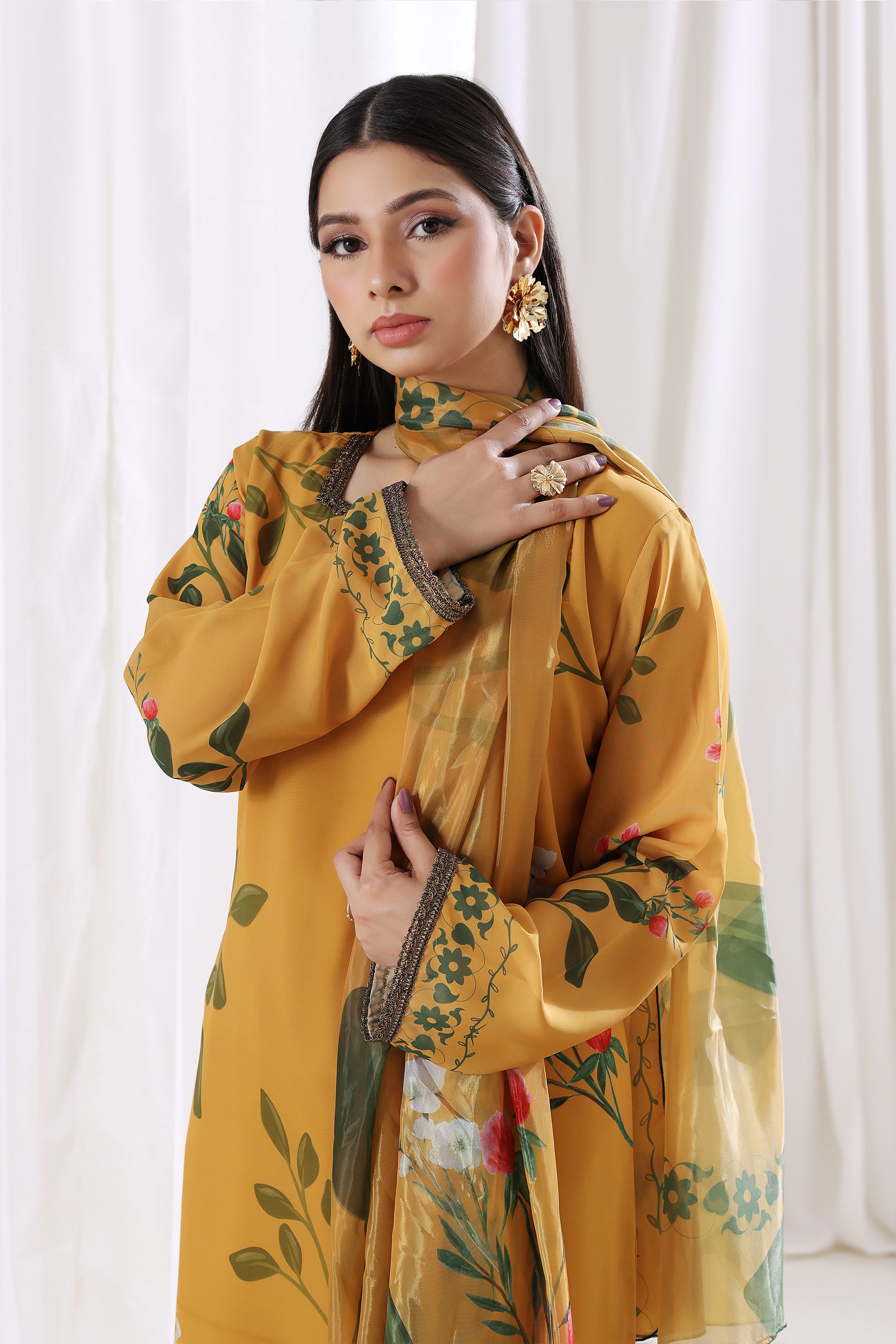 Young woman showcasing Golden Marigold chiffon pret for women by Buraqstore, elegant Pakistani dress