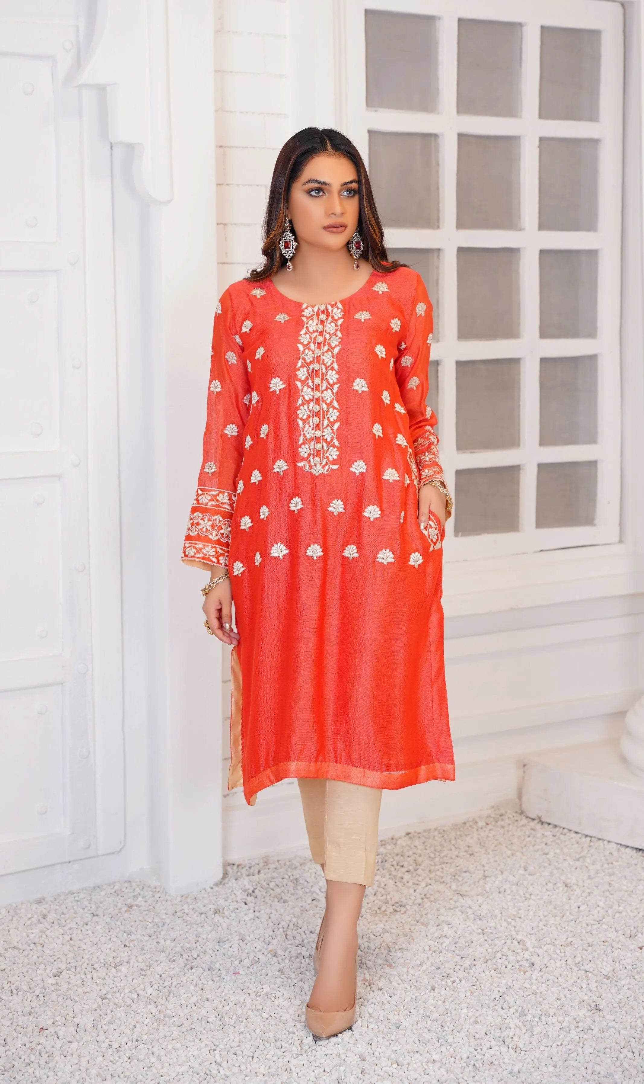 Girl wearing casual orange dress pakistani by buraqstore