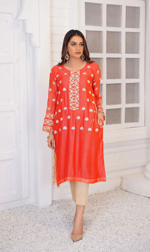 Girl wearing casual orange dress pakistani by buraqstore