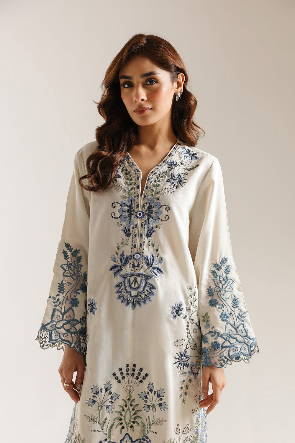 model posing in white eid dress design pakistani 3 piece set buraqstore