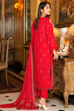 Buraqstore girl posing in embroidered red colour dress karandi fabric