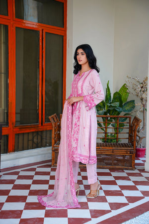 model posing in pink winter dress embroidered buraqstore fashion
