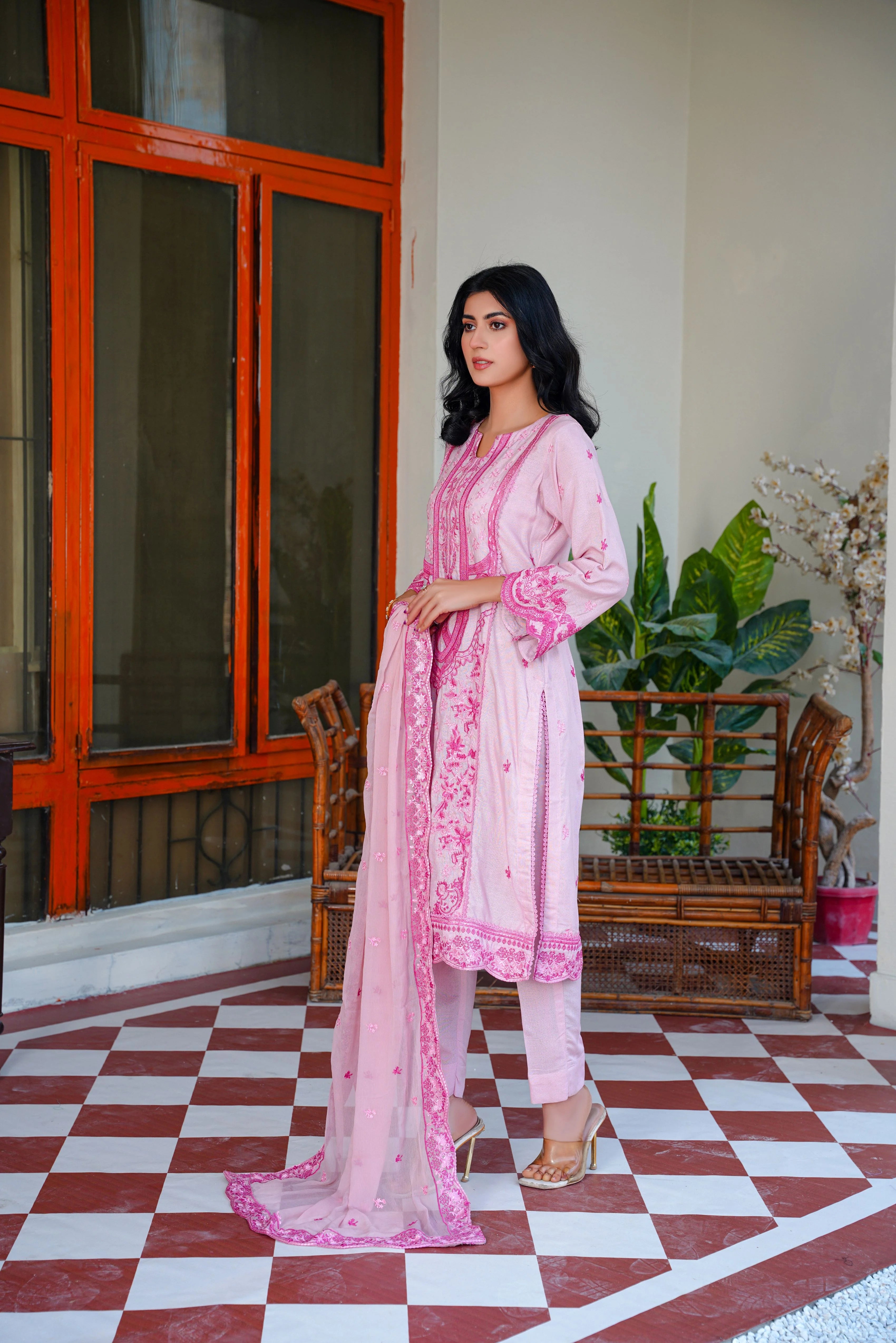 model posing in pink winter dress embroidered buraqstore fashion