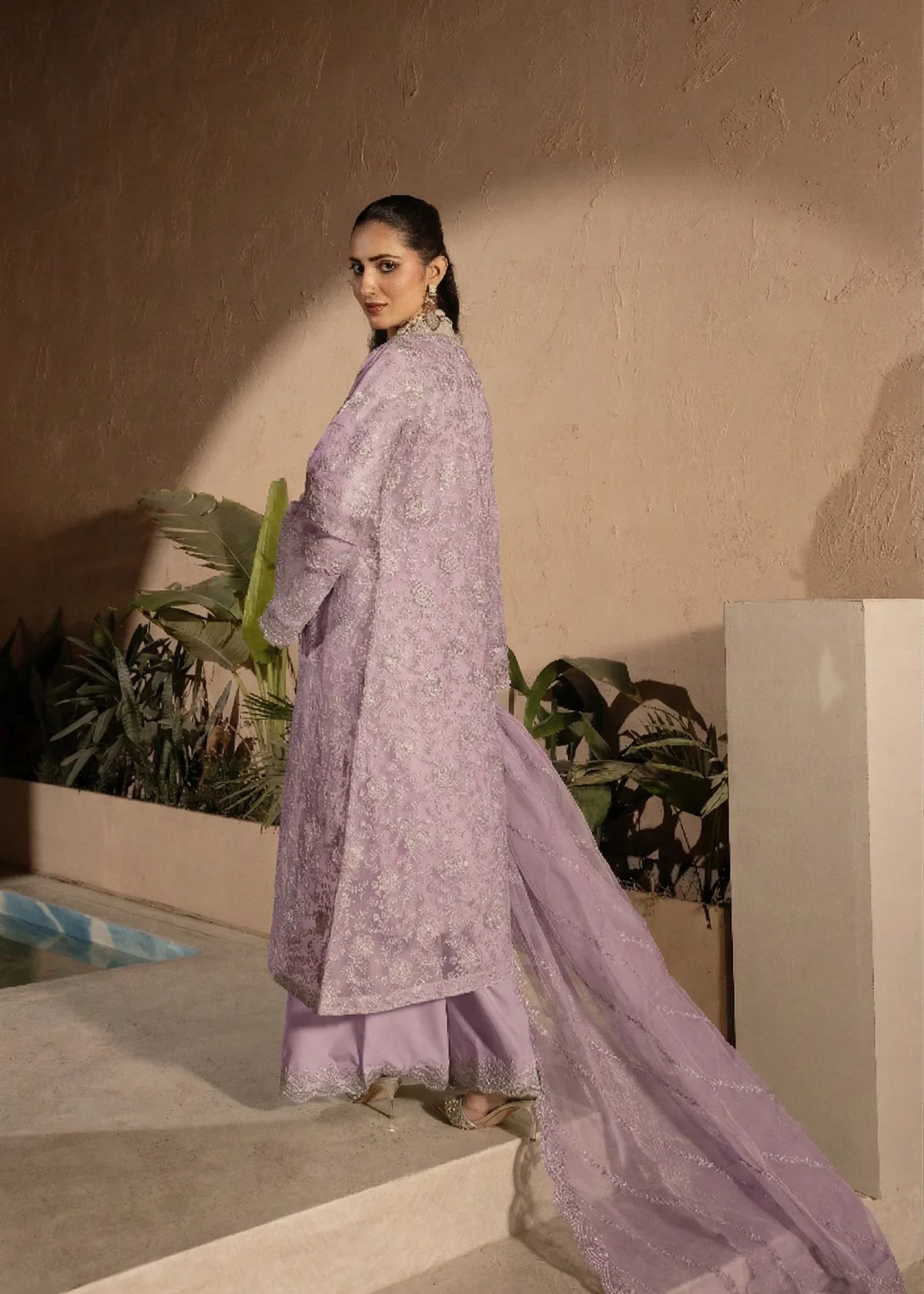 Woman wearing a lilac embellished 4 piece Manahils dress from Manahils dress online shopping, featured at Buraq Store