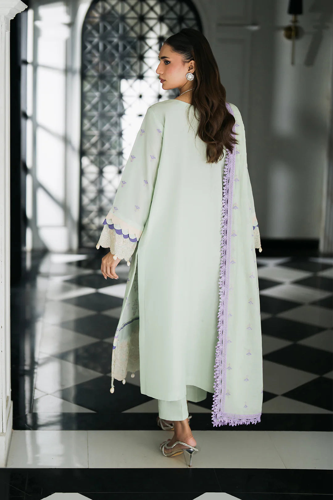 Woman posing in a mint green 3 piece suit from Sidra collection online shopping at Buraq Store