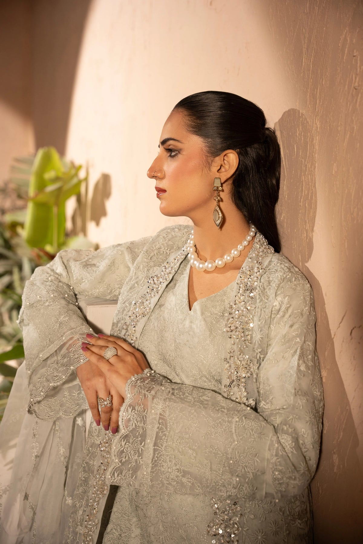 Woman wearing an off white embellished 4 piece outfit for Manahils dress online shopping, featured at Buraq Store