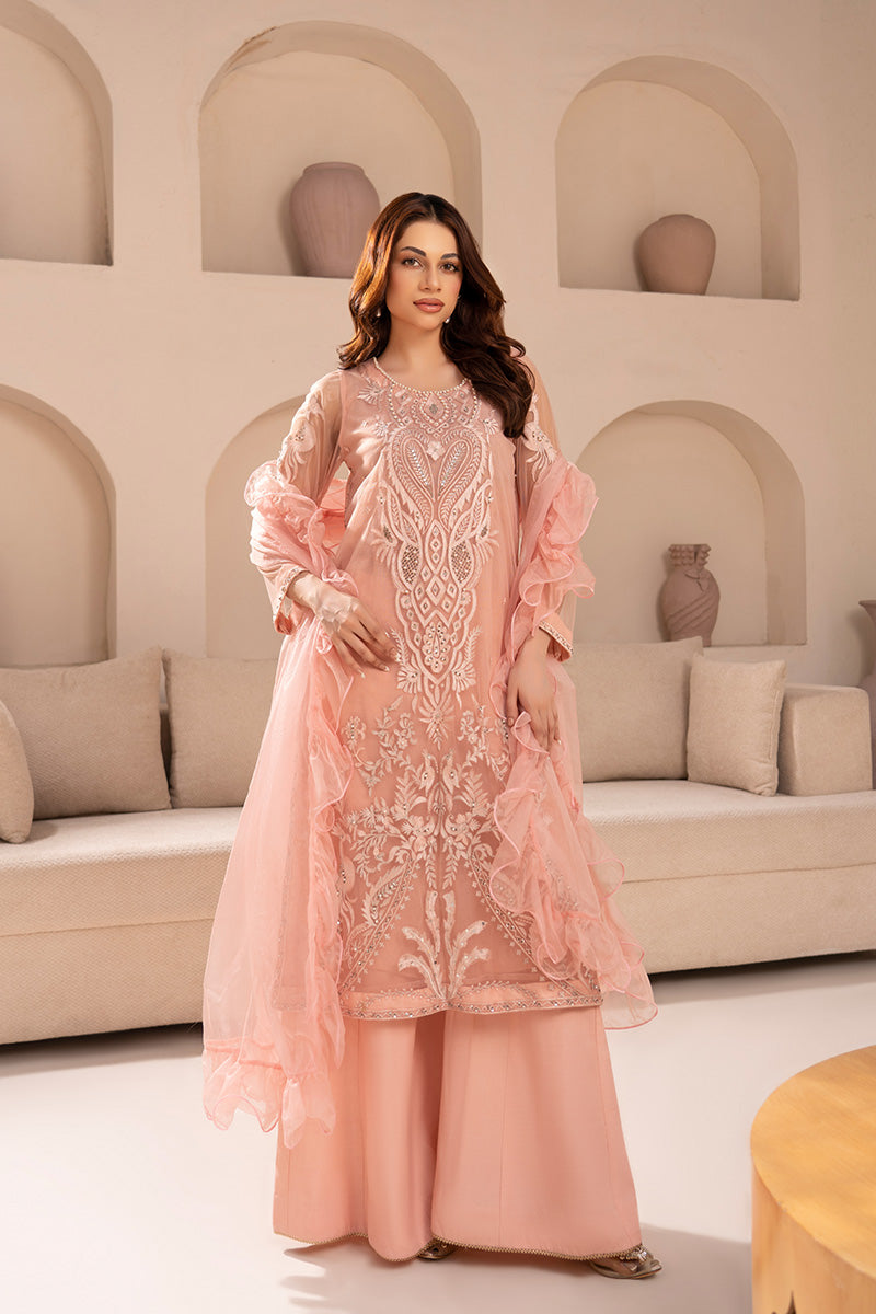 Woman wearing an embroidered 3 piece outfit from the Anayra Amal collection, featured at Buraq Store