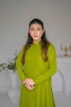 model posing in olive green dress by buraqstore stylish wear