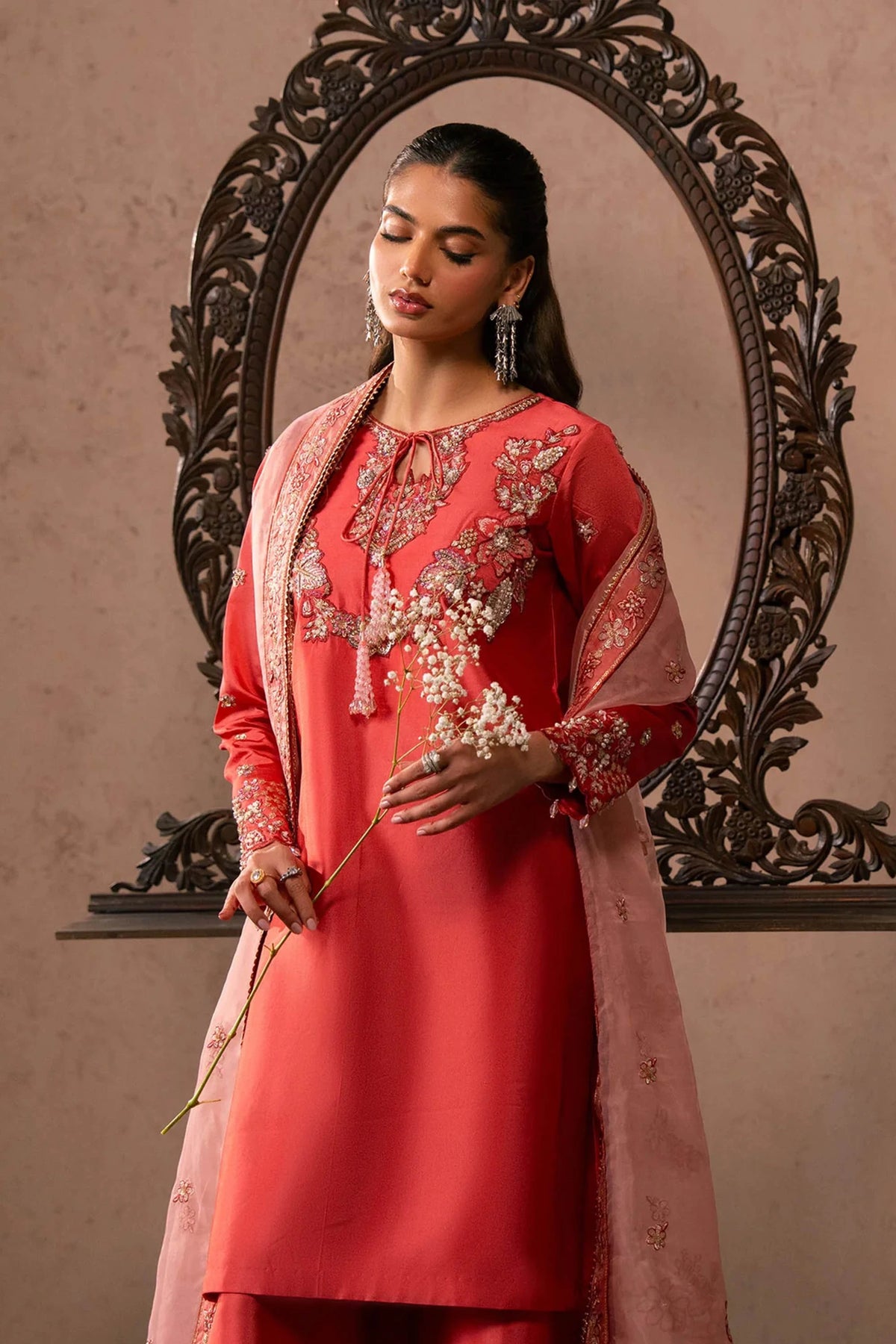 Woman posing in a stylish rose pink Lucia tissue silk 3 piece outfit from the Dastoor collection, featured at Buraq Store