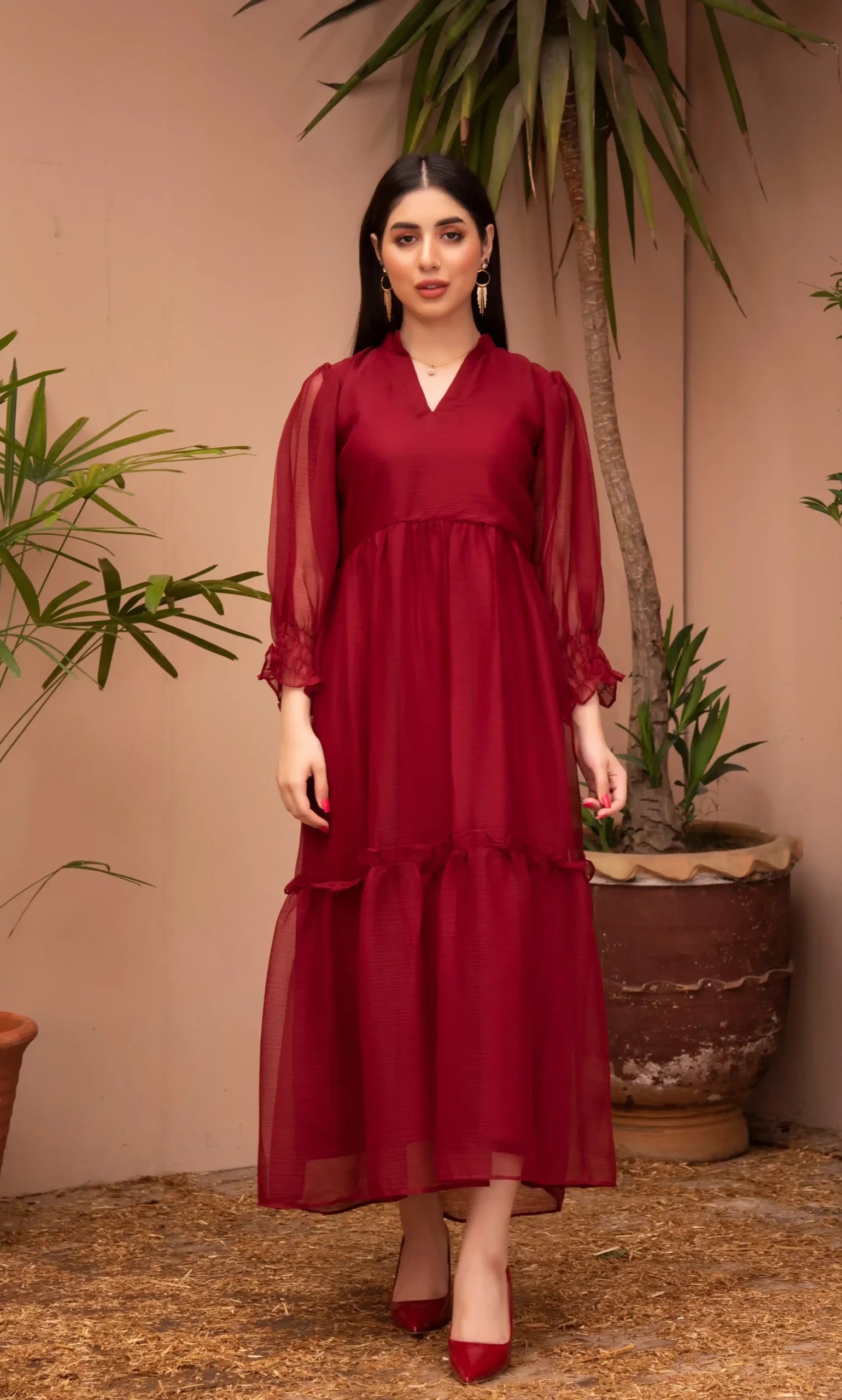 Girl wearing stylish maroon colour dress pret outfit by buraqstore Pakistan