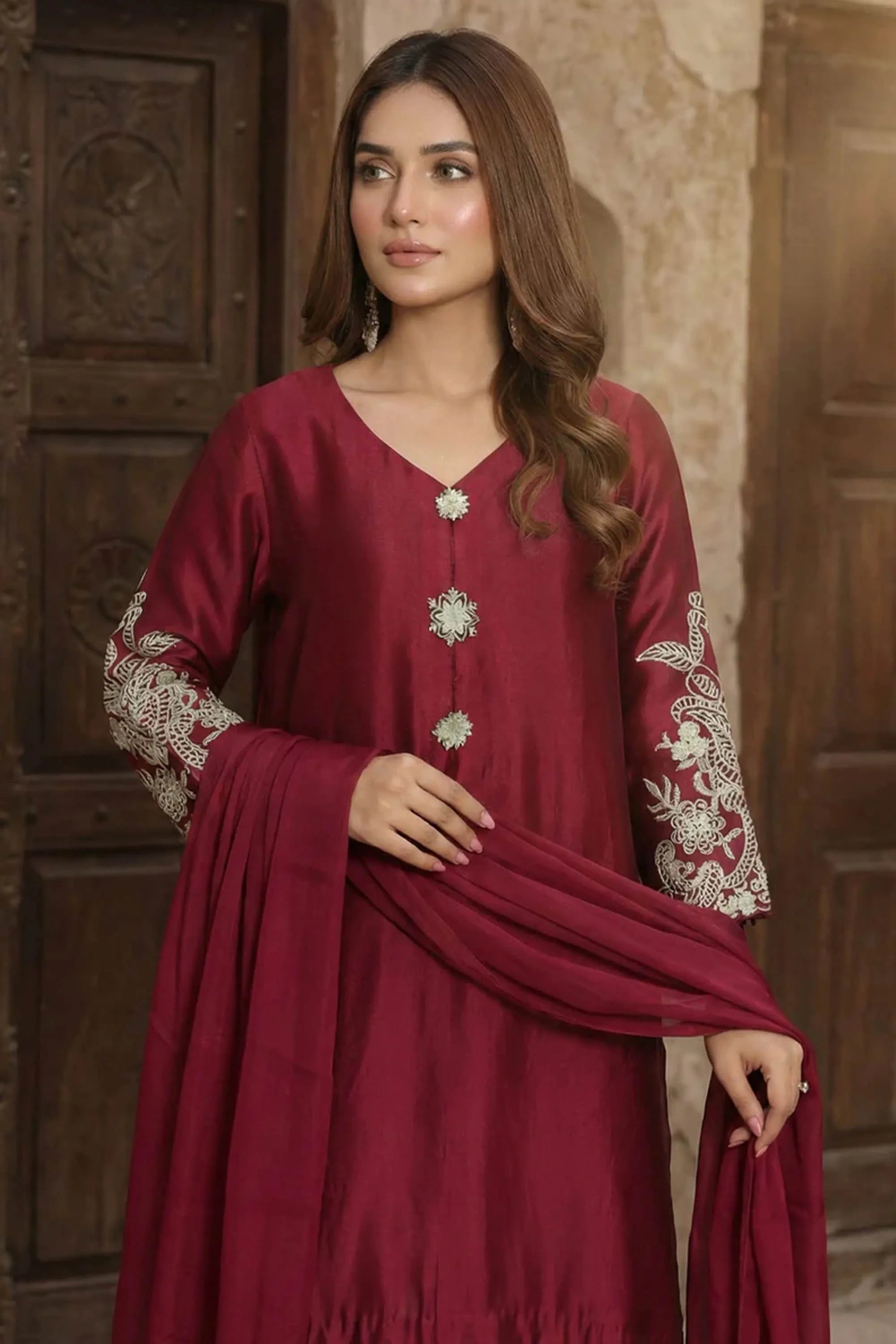 Girl wearing elegant maroon dress design by buraqstore Pakistan