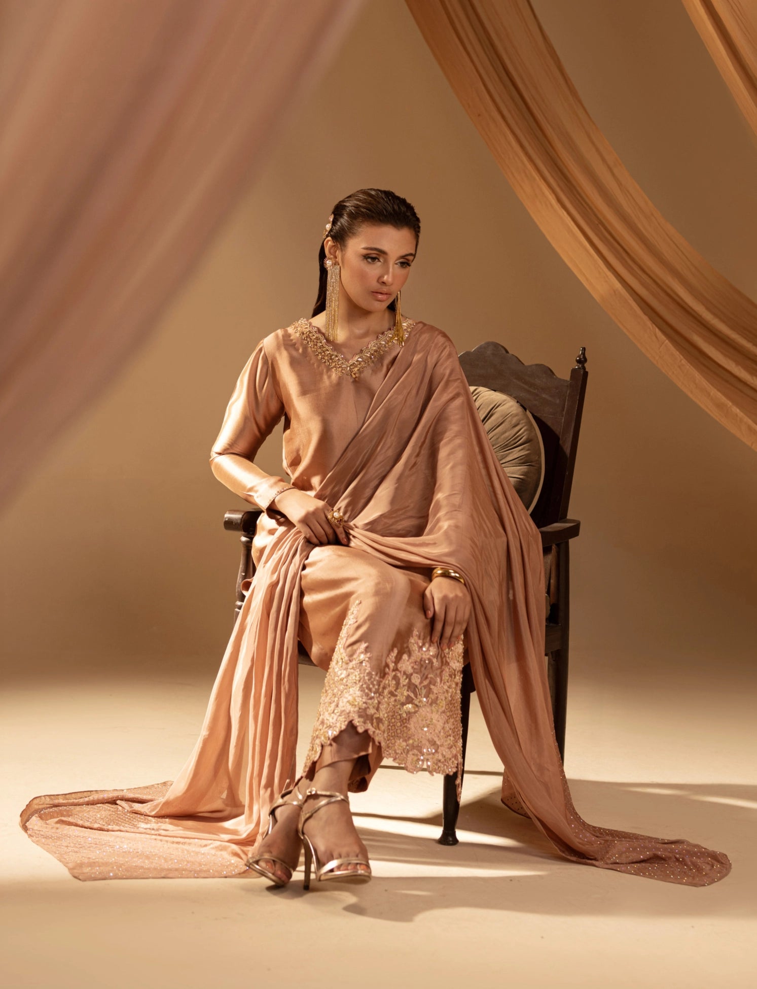 Girl wearing luxurious silk dress by Buraqstore with festive styling