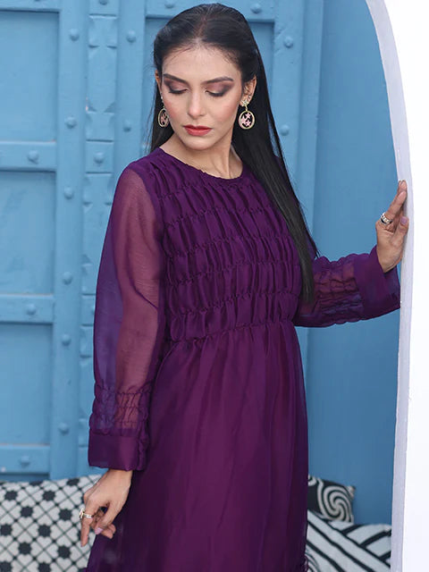 model posing in simple purple dress by buraqstore minimal style