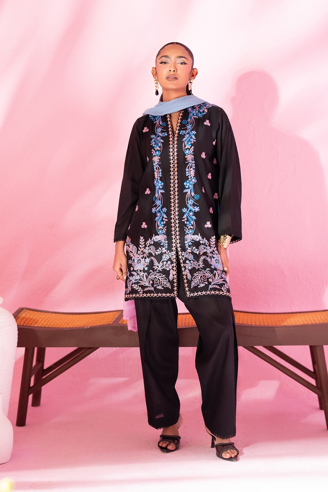 Woman posing in a sophisticated black 3 piece suit from Sidra Fahad official, featured at Buraq Store