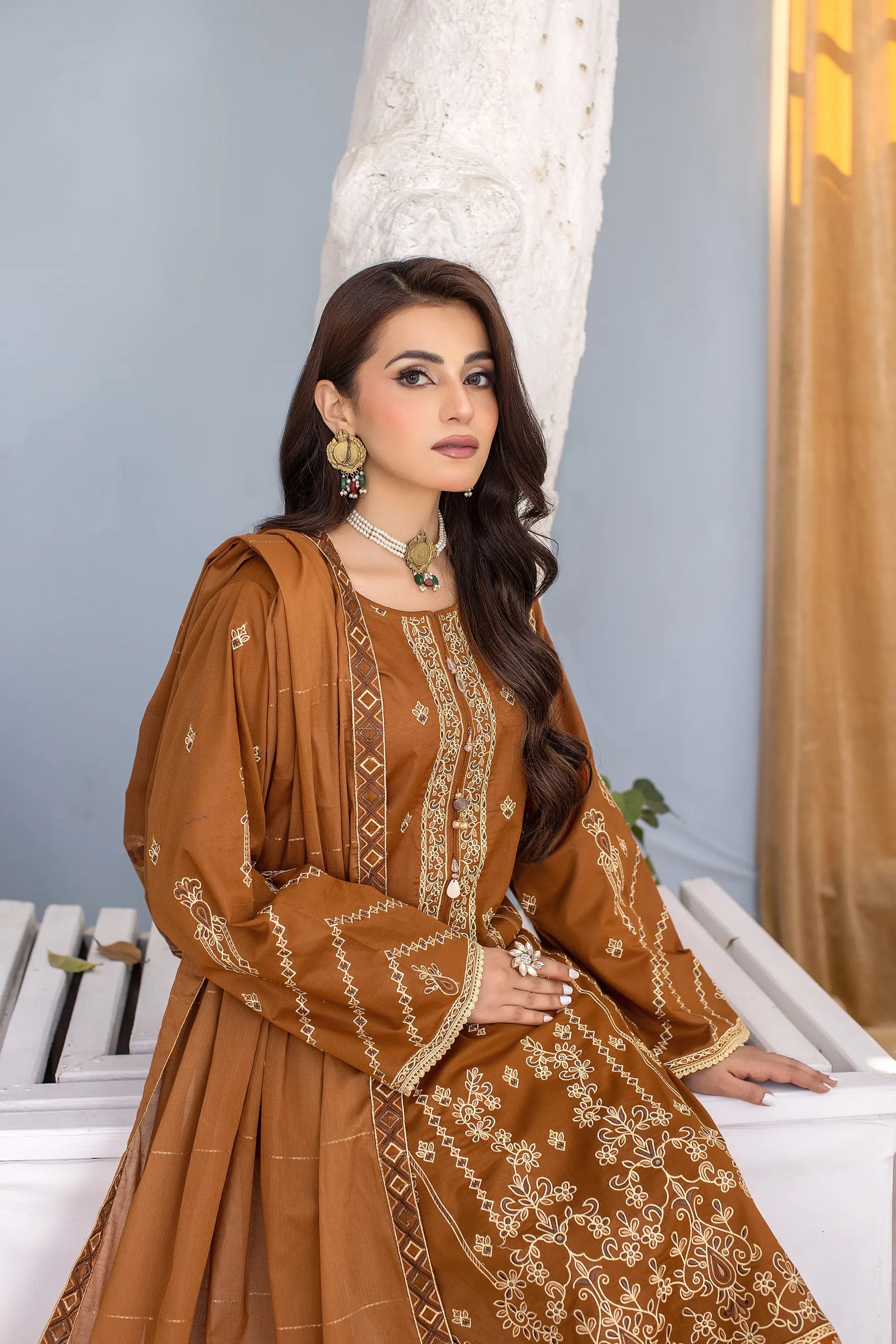 Girl wearing unstitched lawn outfit by Buraqstore styled casually
